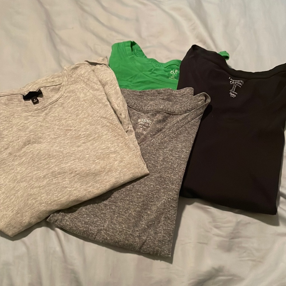4 tees. 2 crew neck and 2 v neck.